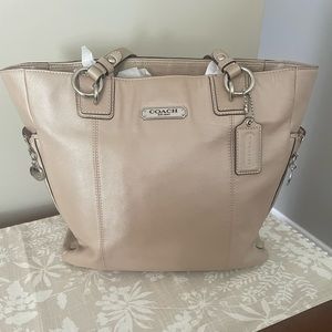 Beautiful coach purse, gently used. Champagne color with pink lining